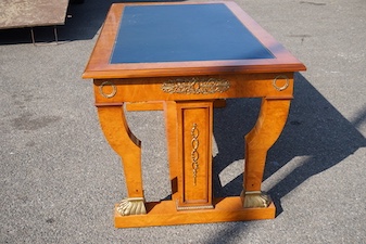 An Empire style gilt metal mounted bird's eye maple bureau plat fitted three drawers, width 160cm, depth 89cm, height 77cm